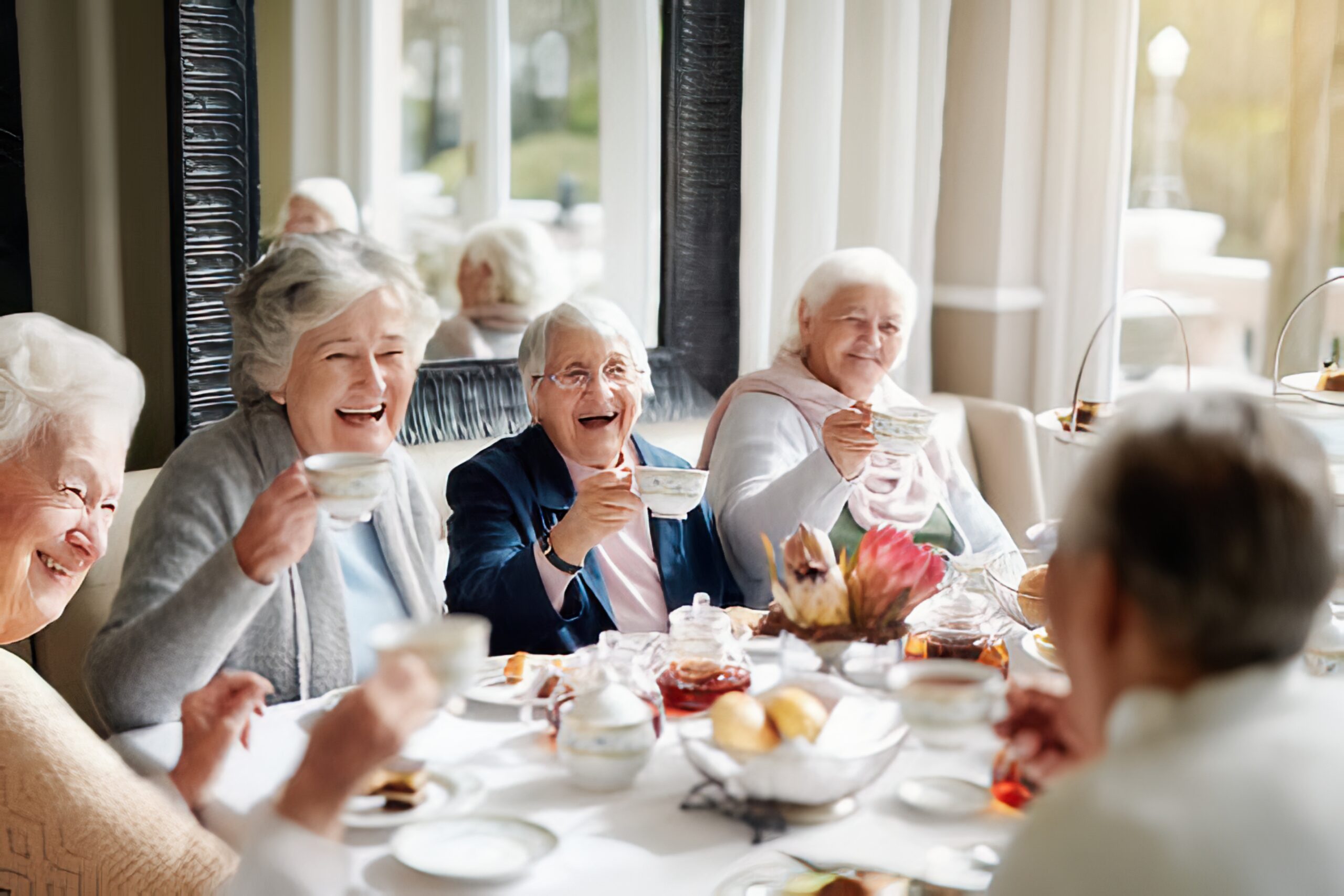 cropped shot of a group of seniors having tea in their retirement home